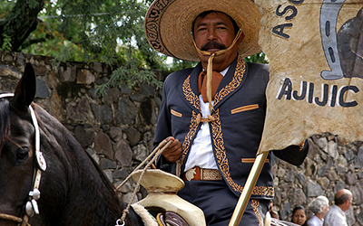 Older Mexican man on horse celebrates Happy Independence Day