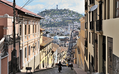 The El Panecillo hill seen from Quito's historic centre along the García Moreno street