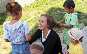 Volunteer working with children at women's shelter in Chile