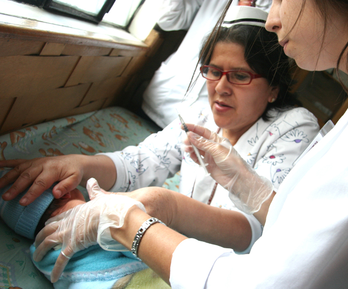 giving vaccinations in Ecuador