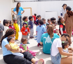 Lousiana State volunteers and teachers play with children at a daycare in Quito