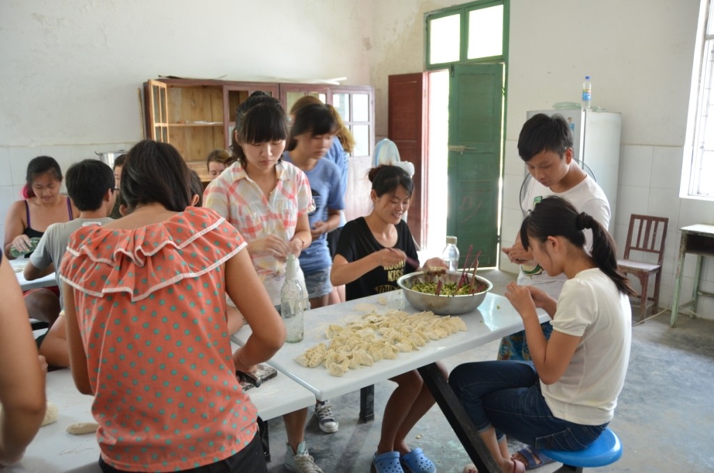 volunteers making dumplings in China