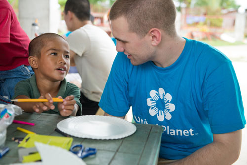 United Planet volunteer with child