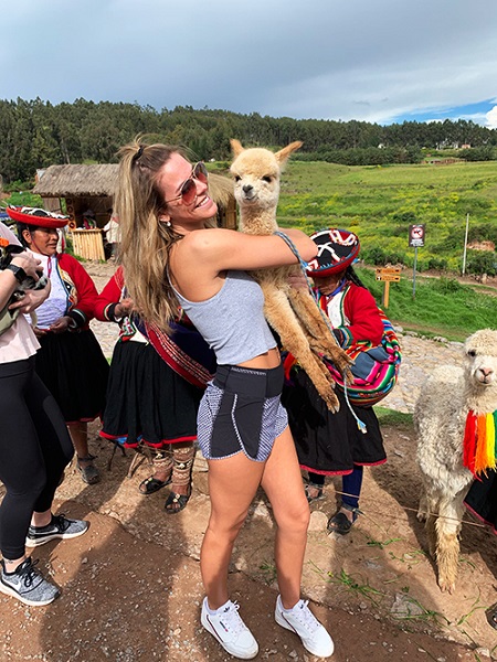 hugging an alpaca