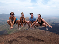 Volunteers jumping on mountain in Honduras